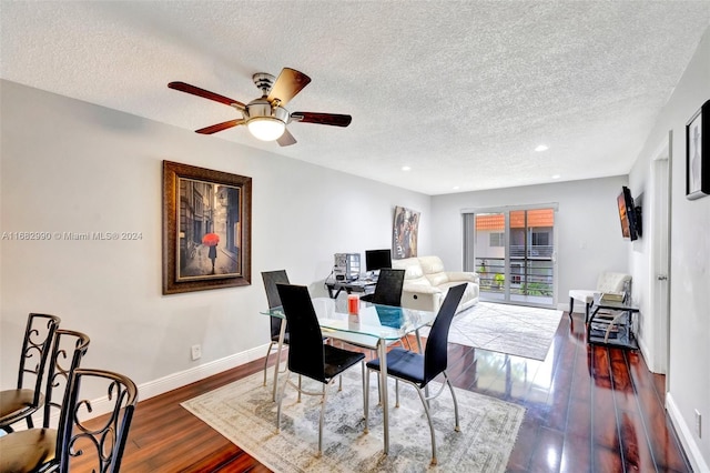 dining area with ceiling fan, a textured ceiling, and dark hardwood / wood-style flooring