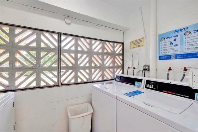 washroom featuring washer and dryer