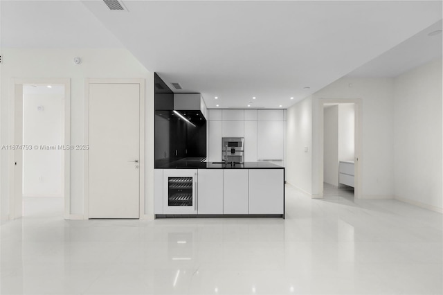 kitchen featuring visible vents, baseboards, modern cabinets, white cabinetry, and recessed lighting