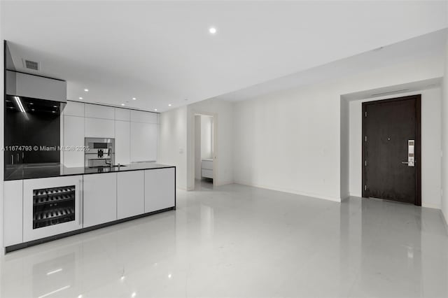 kitchen with visible vents, dark countertops, modern cabinets, white cabinetry, and recessed lighting