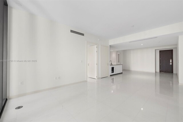 kitchen with white cabinetry and sink