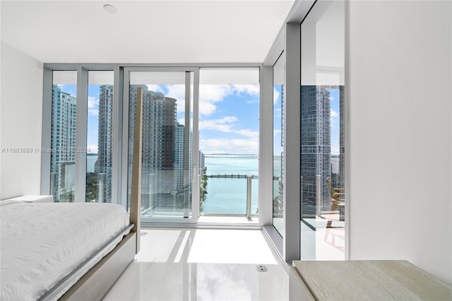 bedroom with multiple windows and floor to ceiling windows