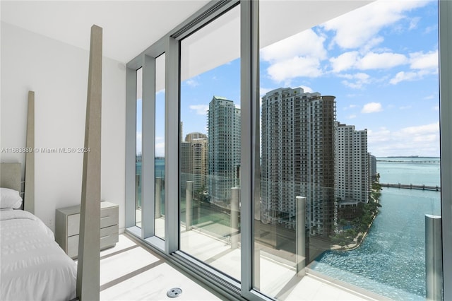 interior space featuring floor to ceiling windows and a water view