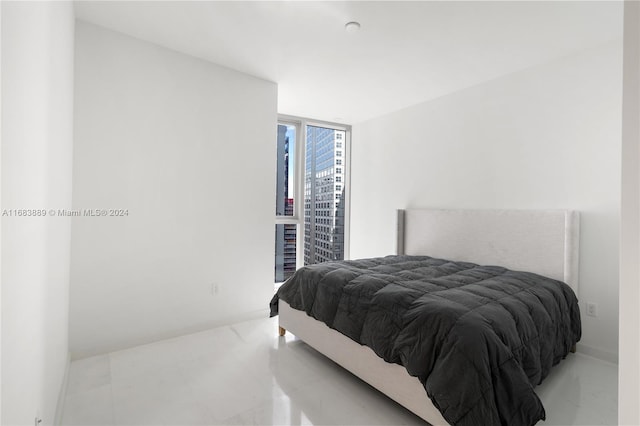 bedroom featuring a wall of windows