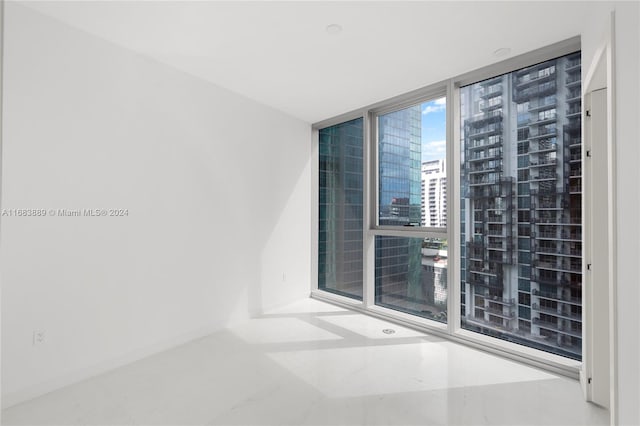 empty room with floor to ceiling windows