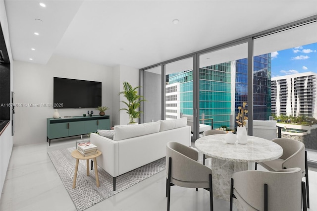 living room with recessed lighting and floor to ceiling windows