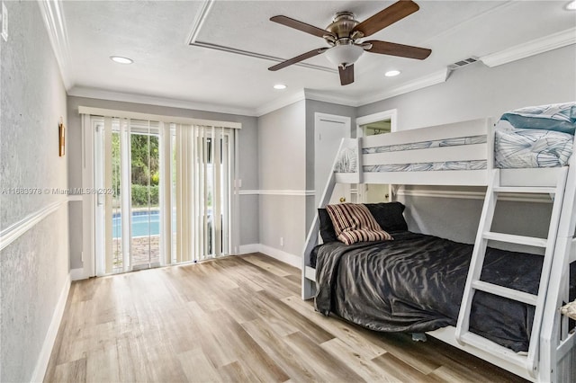 bedroom with ornamental molding, wood-type flooring, access to outside, and ceiling fan