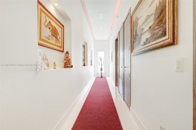 corridor featuring carpet flooring