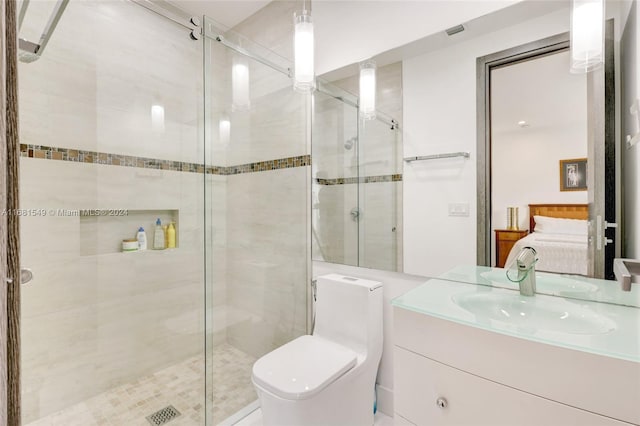 bathroom with vanity, toilet, and walk in shower