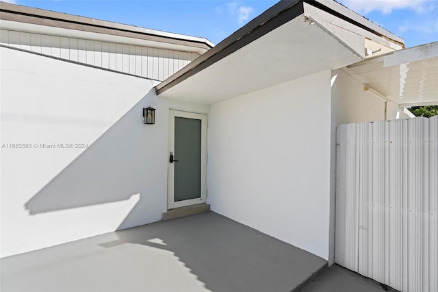 doorway to property featuring a patio