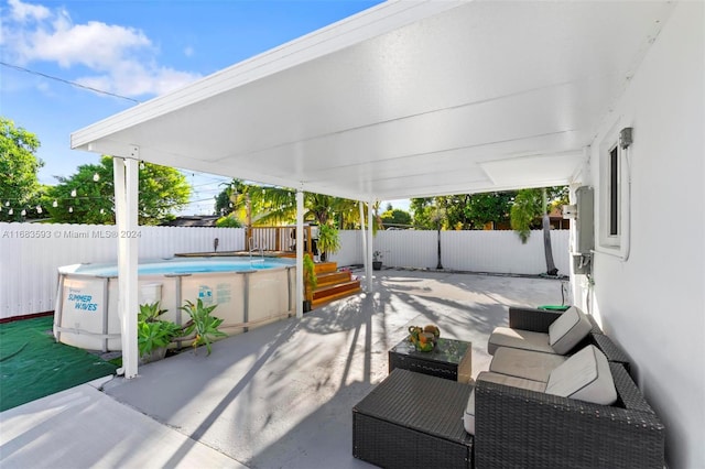 view of patio / terrace with a fenced in pool