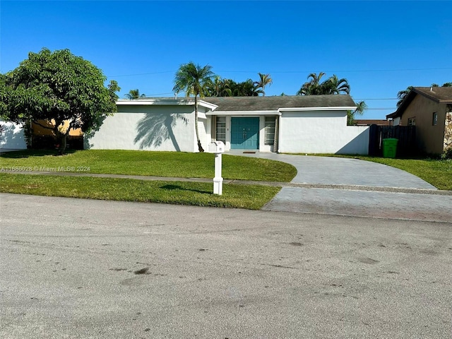 single story home with a front yard