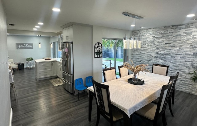 dining area featuring dark hardwood / wood-style flooring