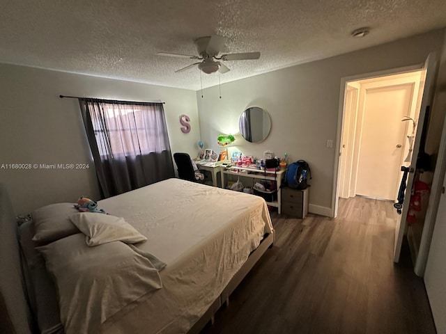 bedroom featuring a textured ceiling, hardwood / wood-style flooring, and ceiling fan