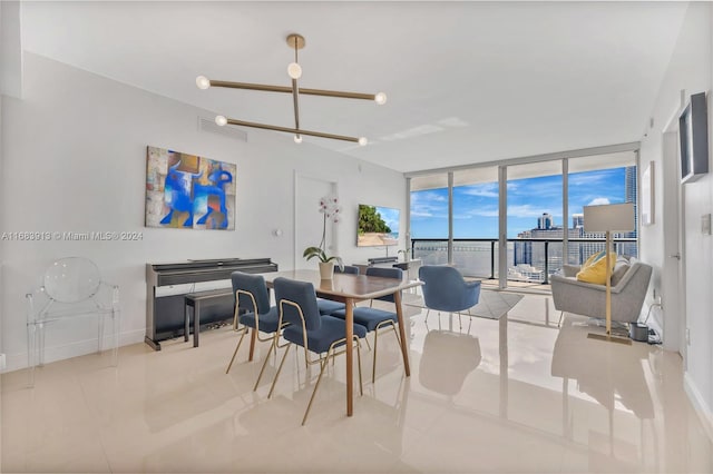 tiled dining area featuring an inviting chandelier and floor to ceiling windows