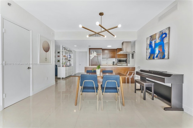 tiled dining space featuring a chandelier