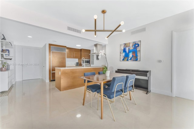 dining area featuring a notable chandelier and light tile patterned floors