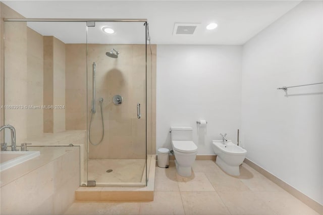 bathroom with toilet, tile patterned floors, walk in shower, and a bidet