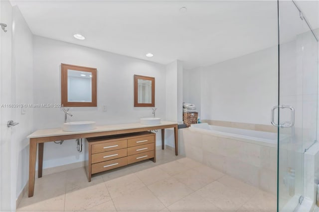 bathroom with vanity, plus walk in shower, and tile patterned flooring