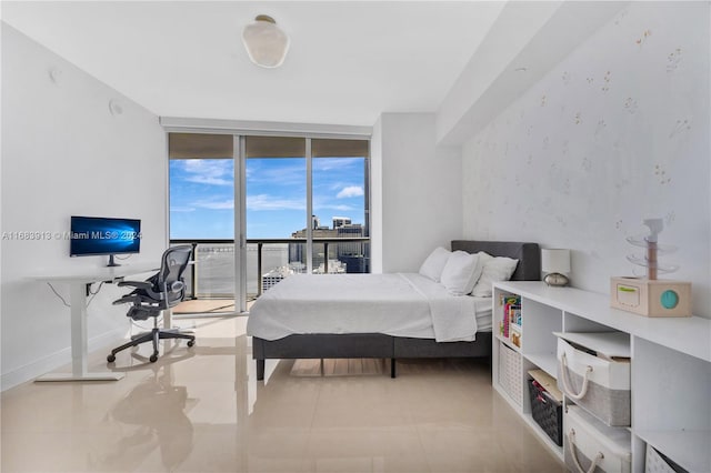 bedroom featuring access to outside and floor to ceiling windows