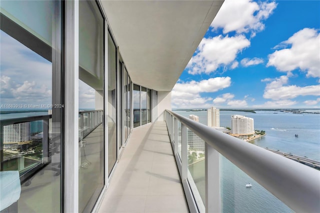 balcony featuring a water view