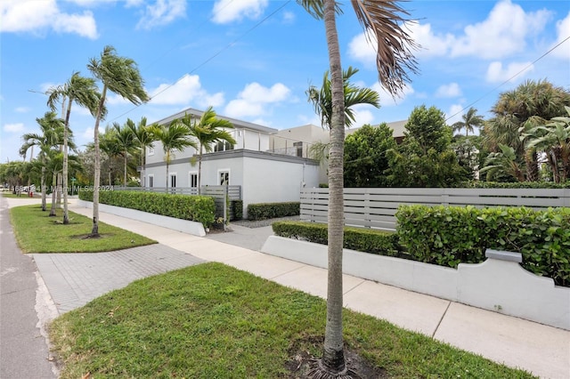 view of side of property with a yard