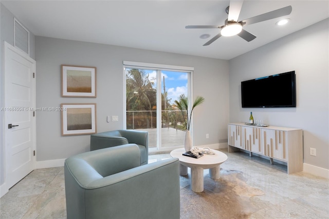 living room featuring ceiling fan