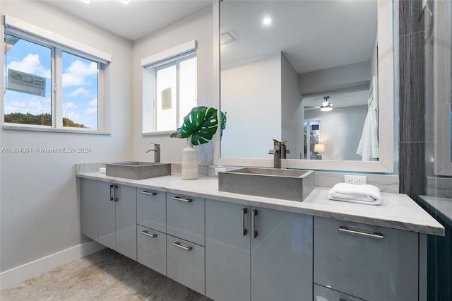 bathroom featuring vanity and ceiling fan