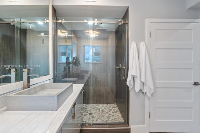 bathroom featuring vanity and walk in shower