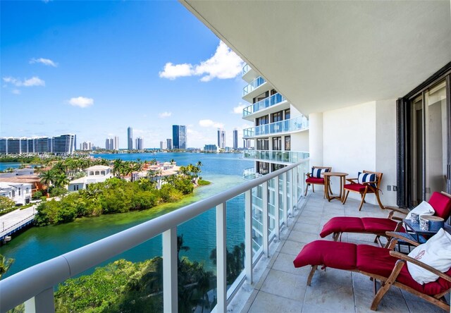 balcony featuring a water view