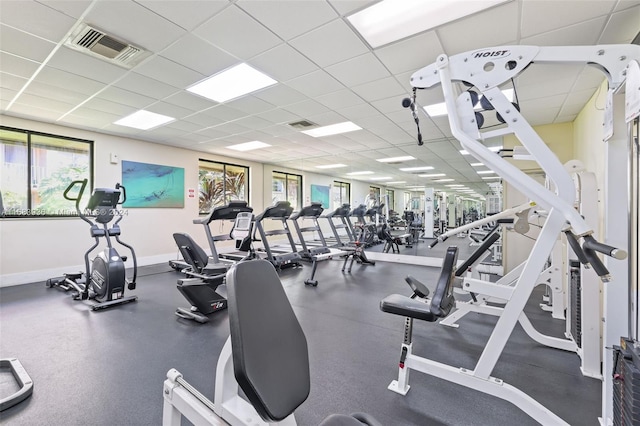 workout area featuring a paneled ceiling