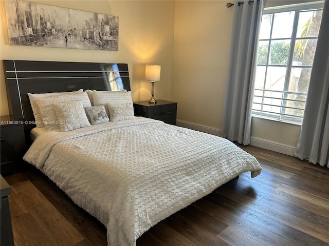 bedroom featuring dark hardwood / wood-style floors