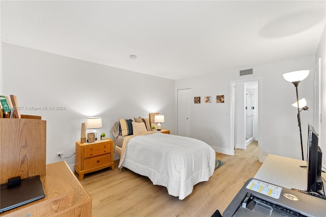 bedroom featuring a closet and light hardwood / wood-style flooring