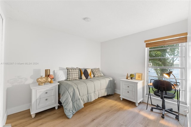 bedroom with light wood-type flooring