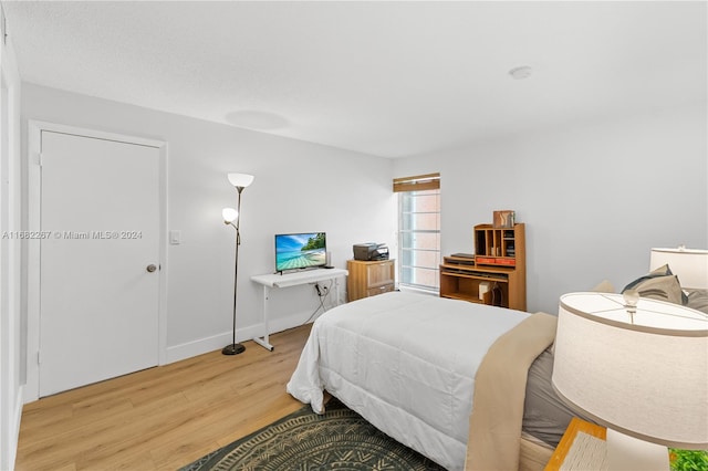 bedroom featuring hardwood / wood-style floors