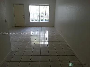 spare room featuring tile patterned floors