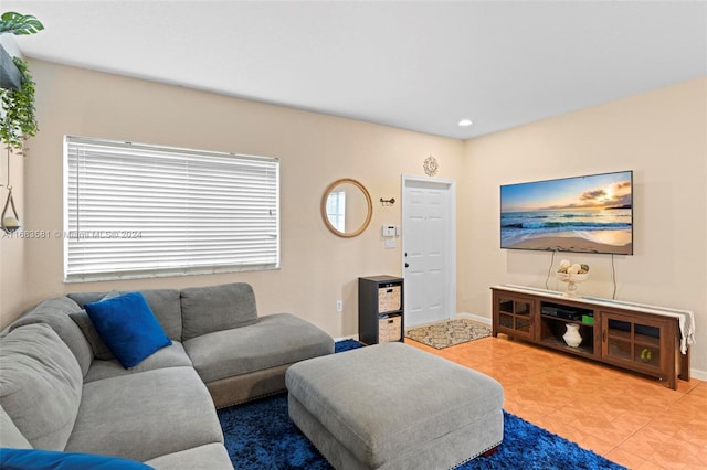 living room with tile patterned floors