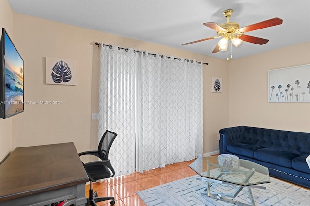 office with ceiling fan and light tile patterned floors