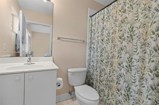 bathroom with vanity, toilet, walk in shower, and tile patterned flooring