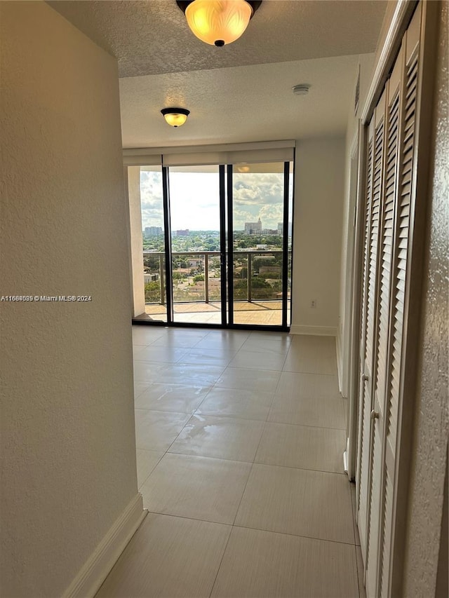2301 SW 27th Ave Unit 1202, Miami, FL 33145 - hall with a textured wall and a textured ceiling