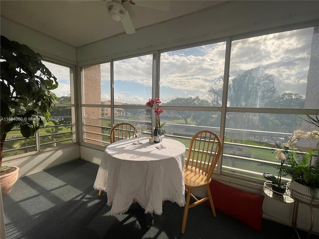 sunroom / solarium with ceiling fan