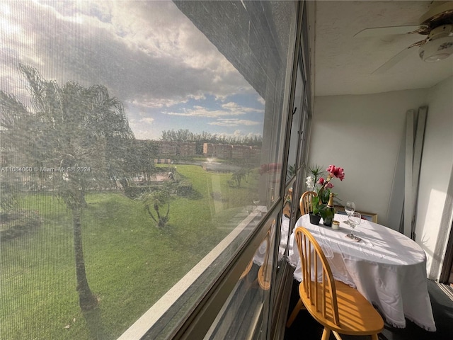 balcony featuring ceiling fan