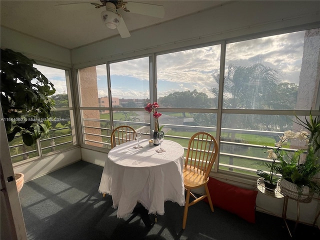 sunroom / solarium with ceiling fan