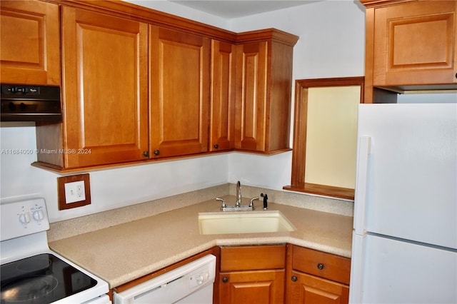 kitchen with white appliances and sink