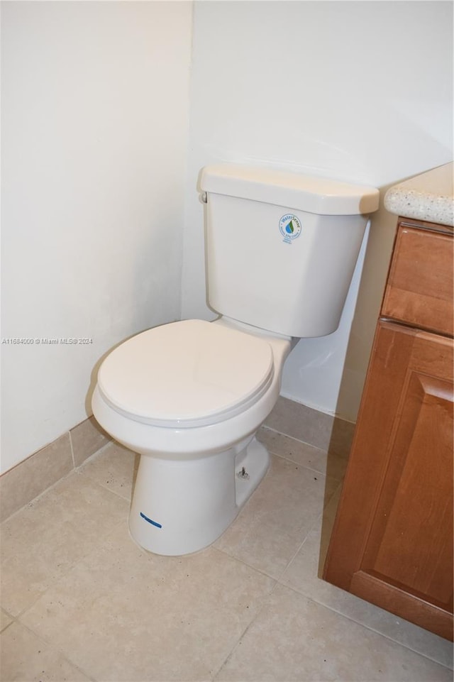 bathroom featuring vanity, toilet, and tile patterned floors