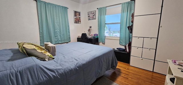 bedroom featuring hardwood / wood-style flooring