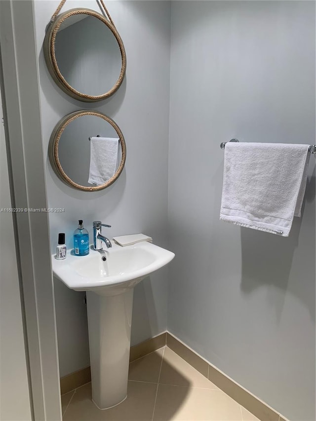 bathroom with tile patterned floors