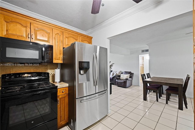 kitchen featuring ceiling fan, tasteful backsplash, black appliances, light tile patterned flooring, and crown molding