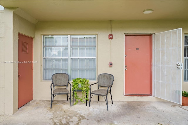 entrance to property with a patio area