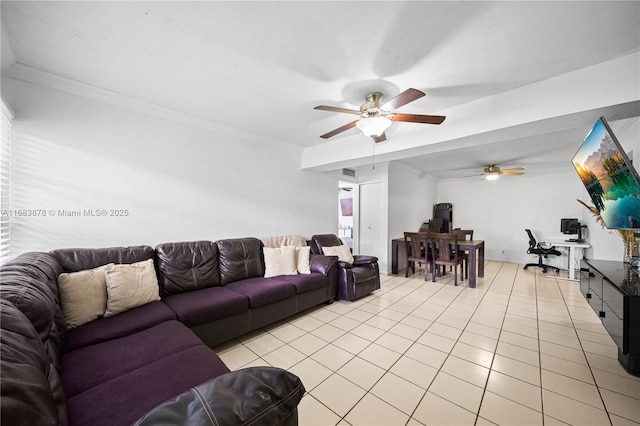 living room with light tile patterned floors and ornamental molding